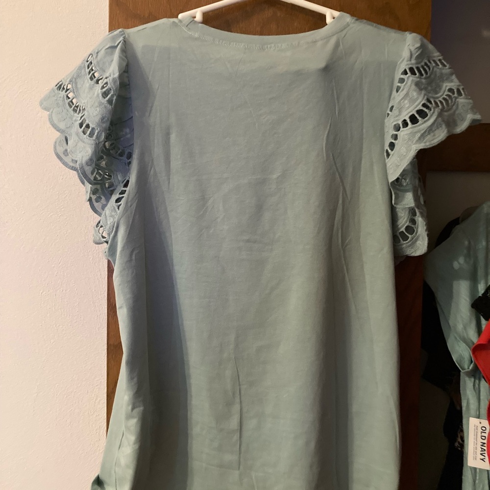 Light blue shirt with lace sleeves